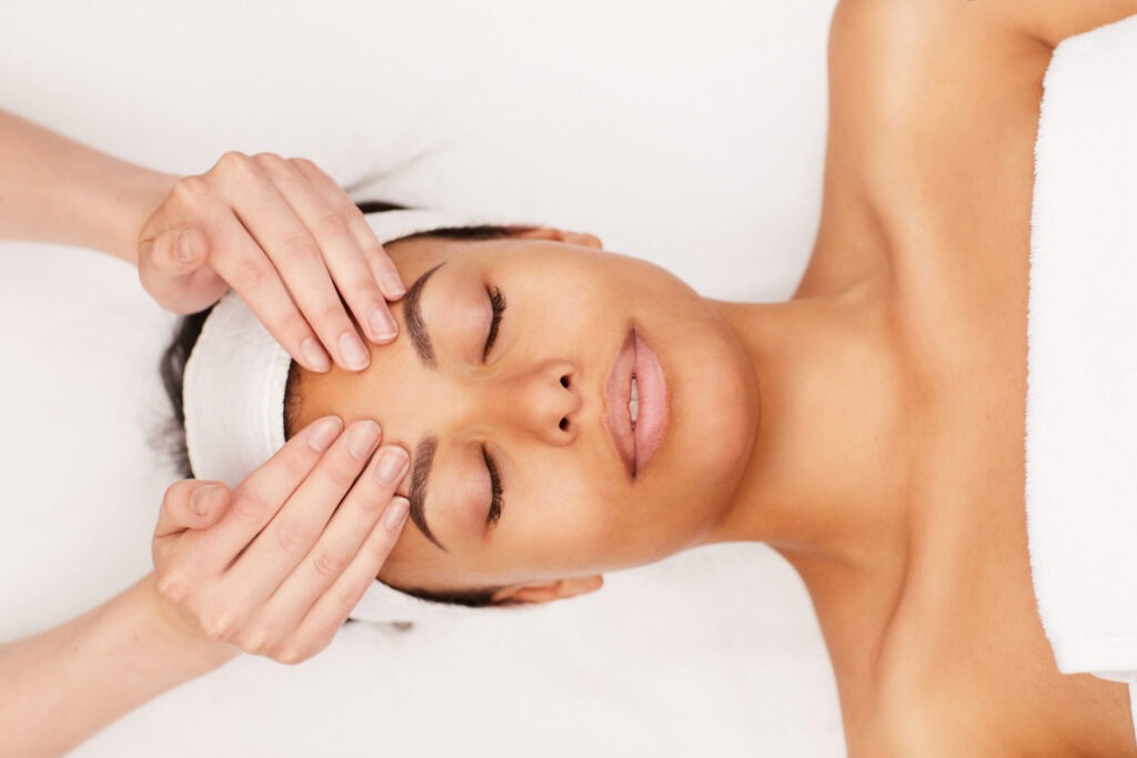 mixed race woman enjoying face massage in spa 2025 03 09 02 34 20 utc